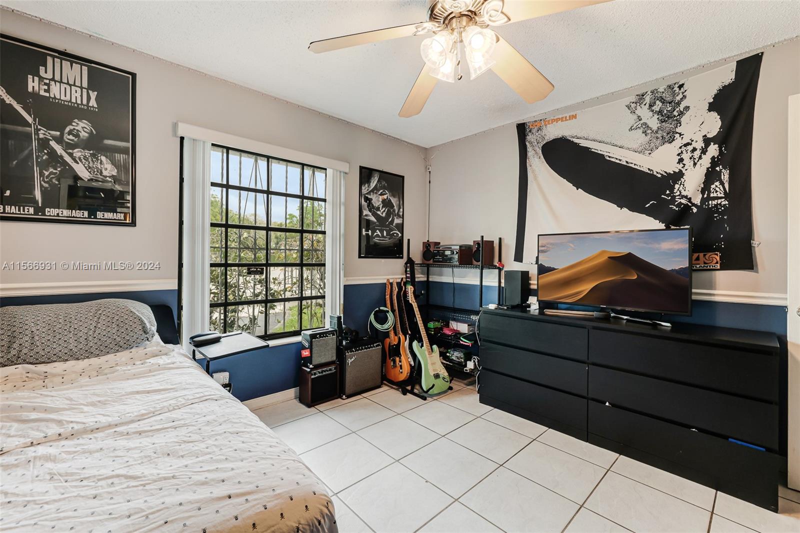 13202 Southwest 12th Lane Miami, FL 33184 - Photo 26 of 47 a bedroom with a bed and cabinets