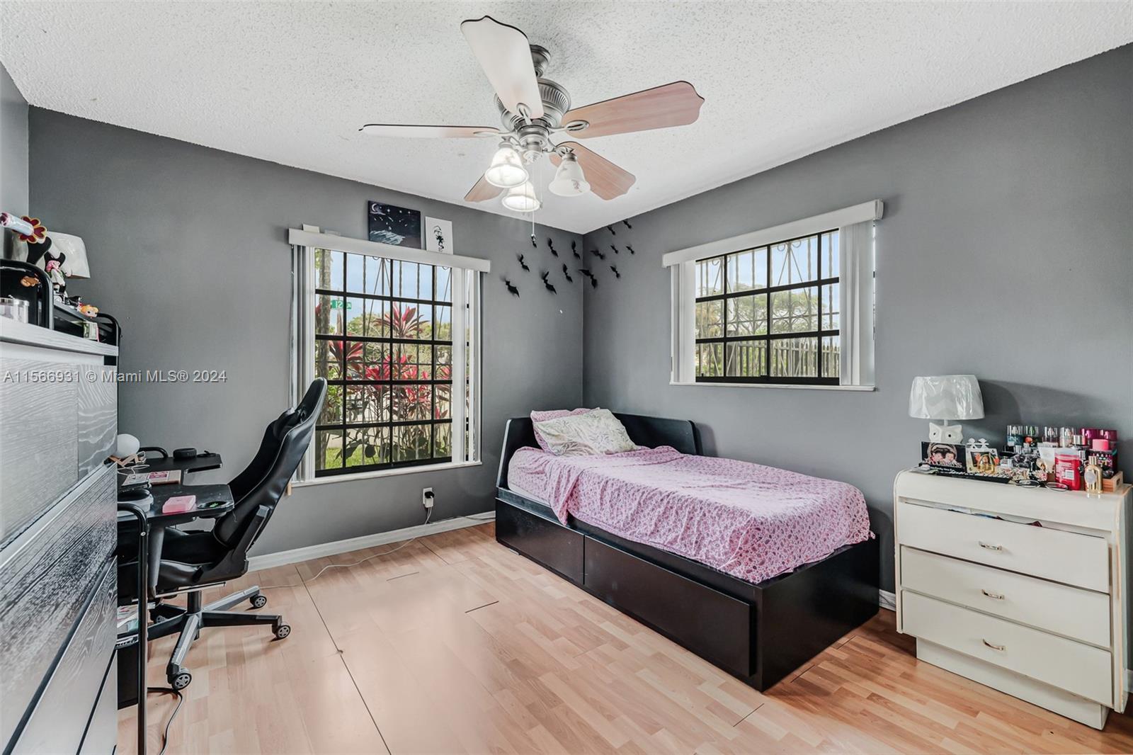 13202 Southwest 12th Lane Miami, FL 33184 - Photo 29 of 47 a bedroom with a bed window and a desk