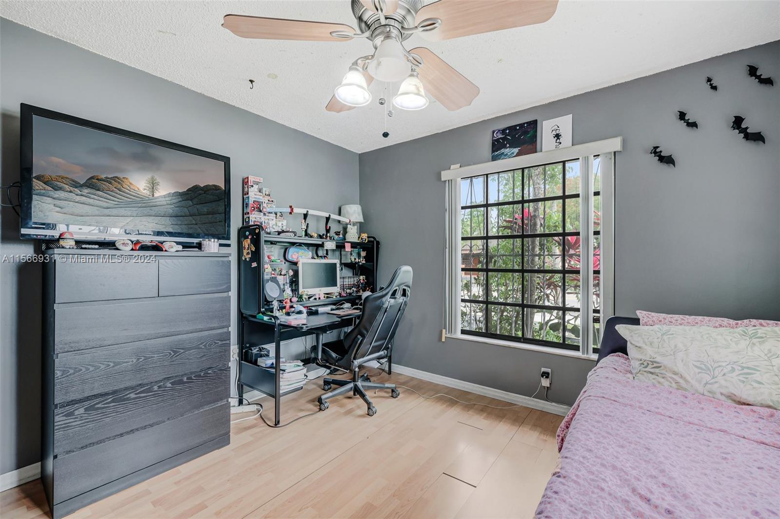 13202 Southwest 12th Lane Miami, FL 33184 - Photo 30 of 47 a bedroom with furniture and a window