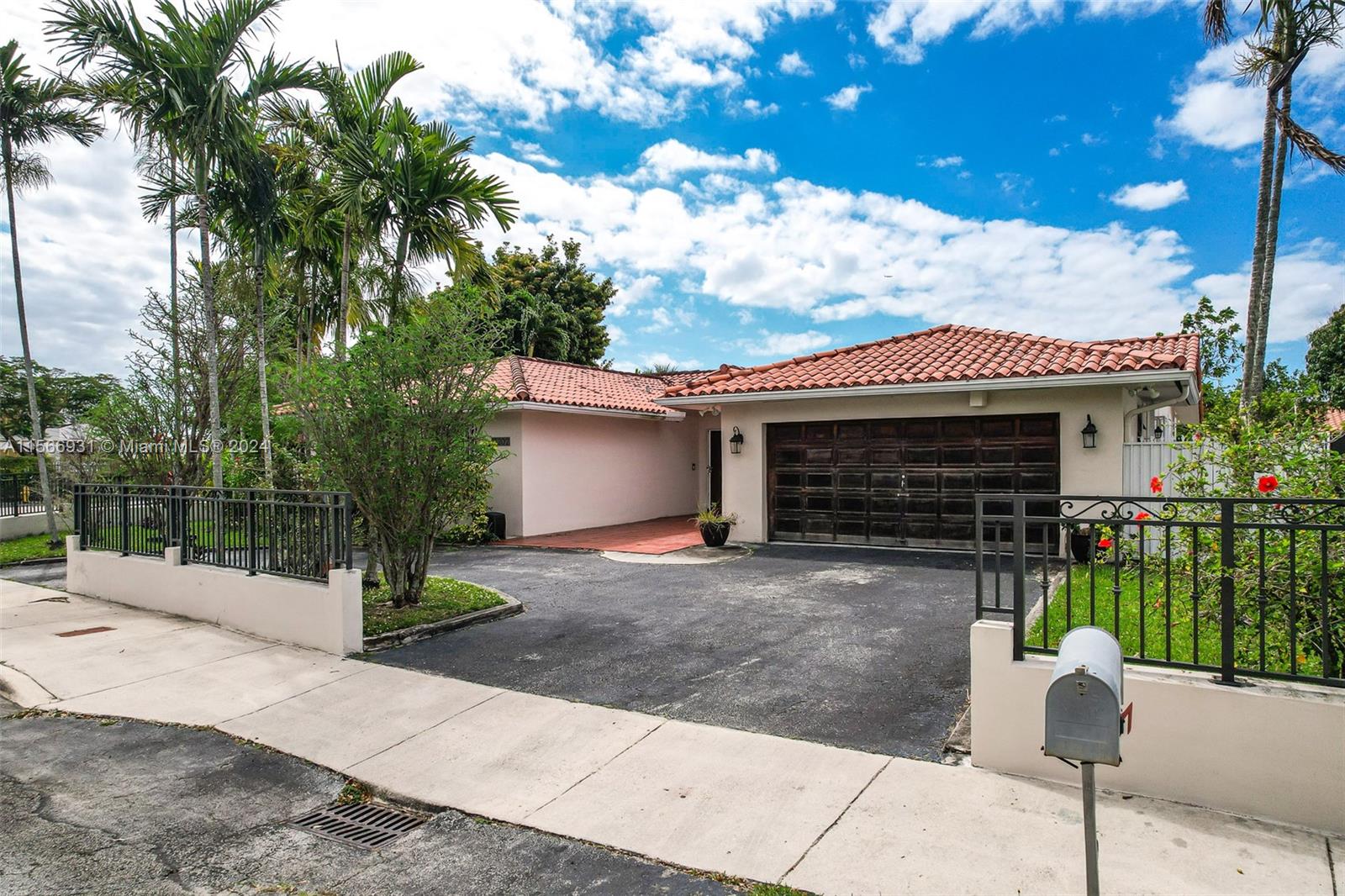 13202 Southwest 12th Lane Miami, FL 33184 - Photo 3 of 47 a front view of a house with a garden