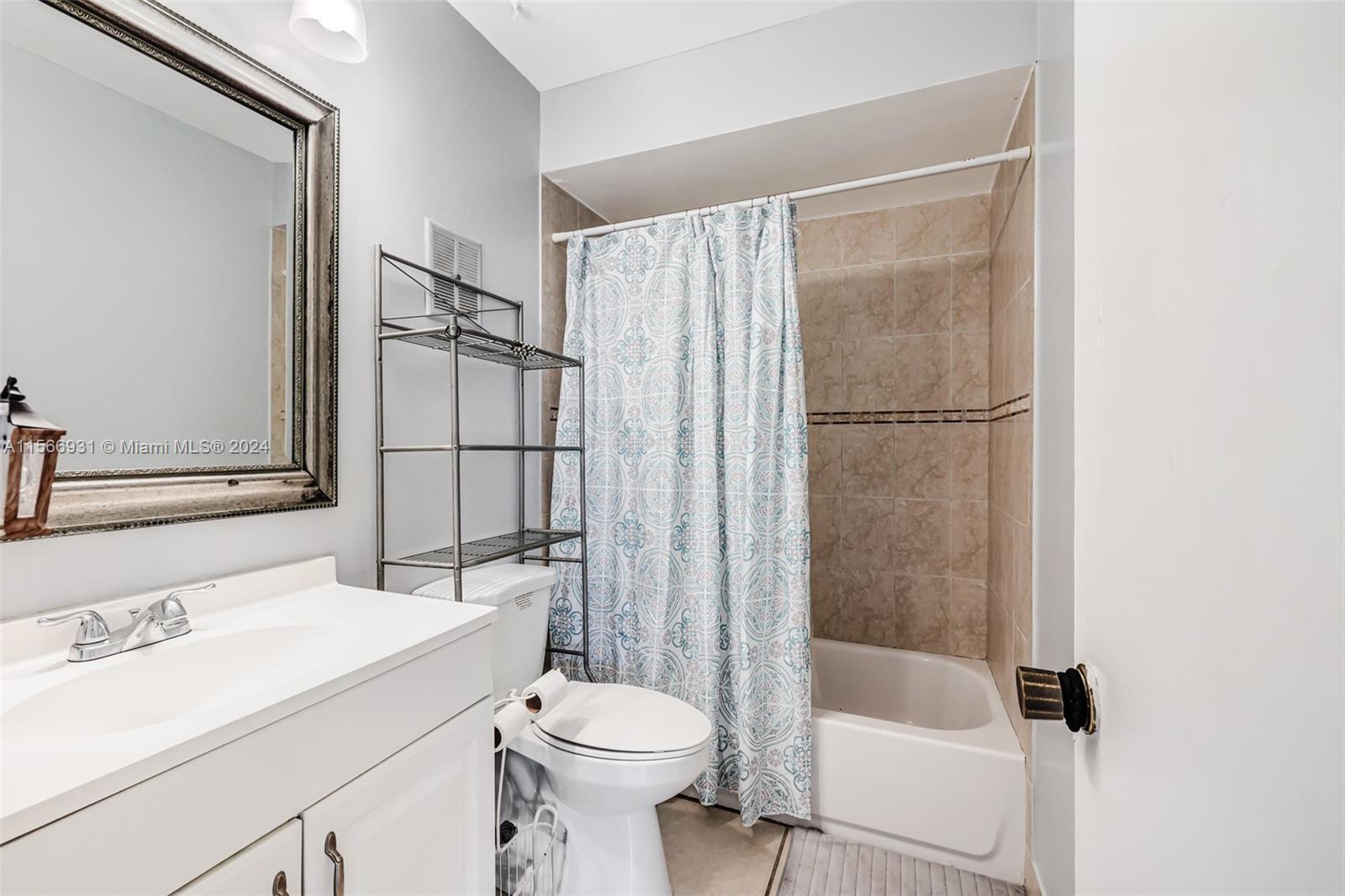 13202 Southwest 12th Lane Miami, FL 33184 - Photo 31 of 47 a bathroom with a sink toilet and shower