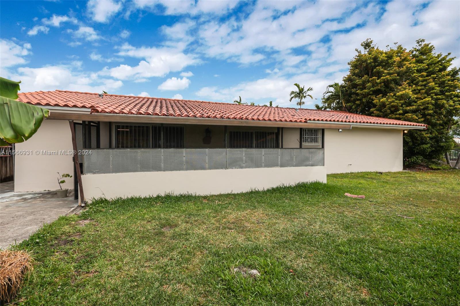 13202 Southwest 12th Lane Miami, FL 33184 - Photo 37 of 47 a front view of a house with garden