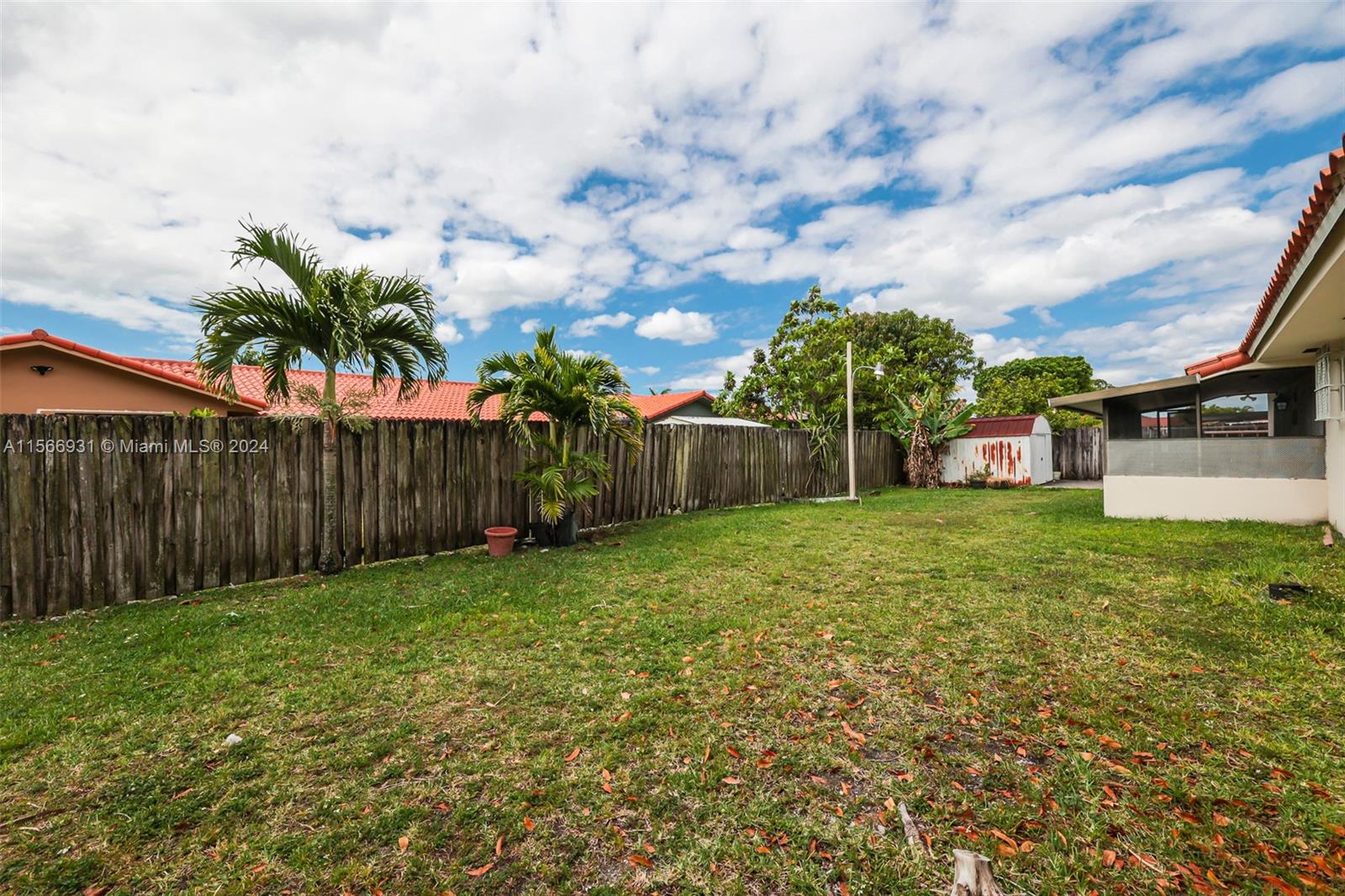 13202 Southwest 12th Lane Miami, FL 33184 - Photo 39 of 47 a view of a backyard with wooden fence