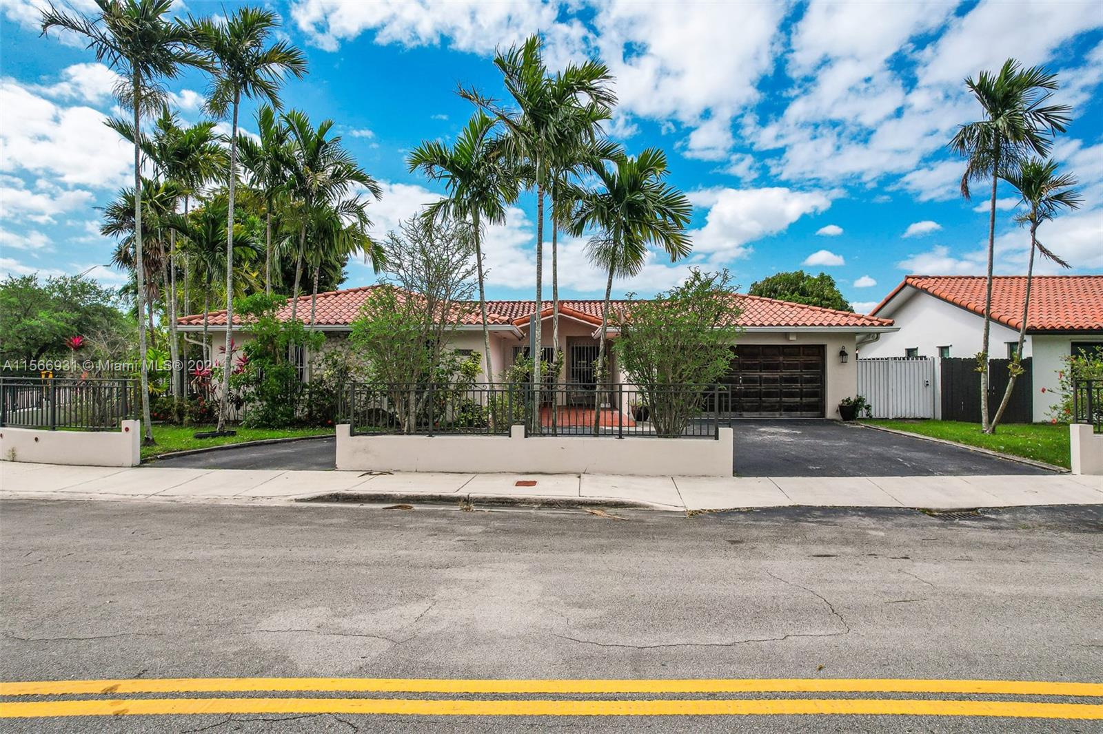 13202 Southwest 12th Lane Miami, FL 33184 - Photo 4 of 47 a house with palm tree in front of it