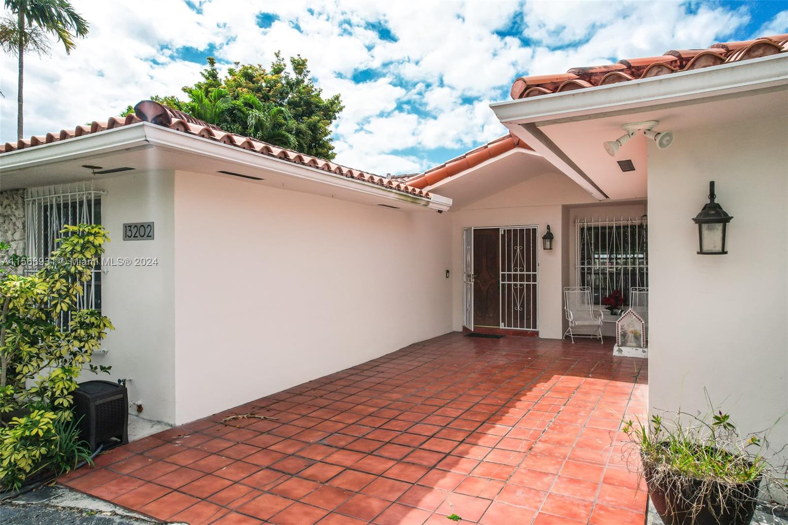13202 Southwest 12th Lane Miami, FL 33184 - Photo 5 of 47 a backyard of a house with seating space
