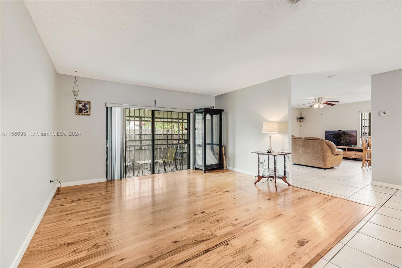 13202 Southwest 12th Lane Miami, FL 33184 - Photo 7 of 47 a view of a livingroom with furniture and a ceiling fan