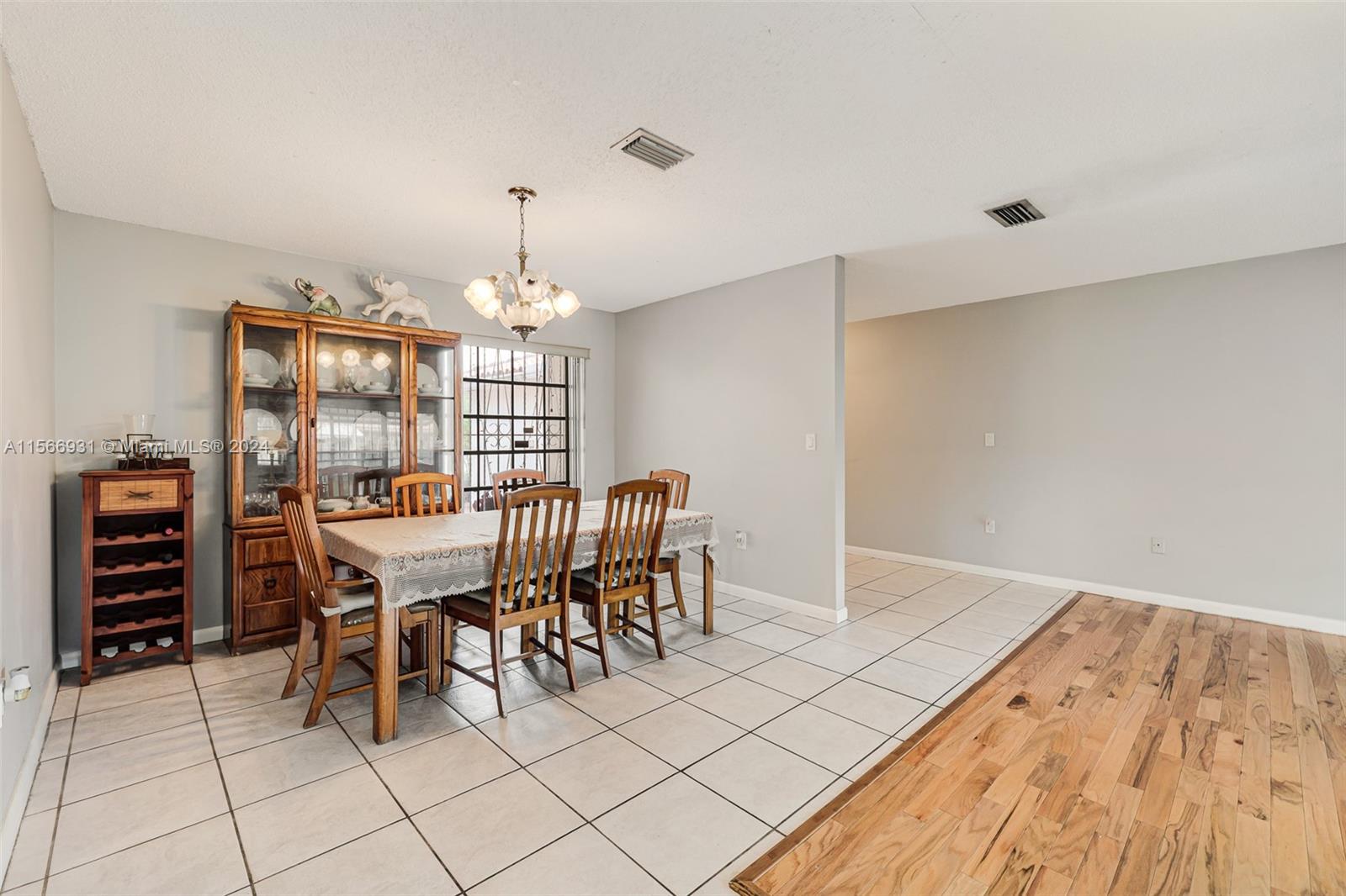 13202 Southwest 12th Lane Miami, FL 33184 - Photo 10 of 47 a dining room with furniture and chandelier