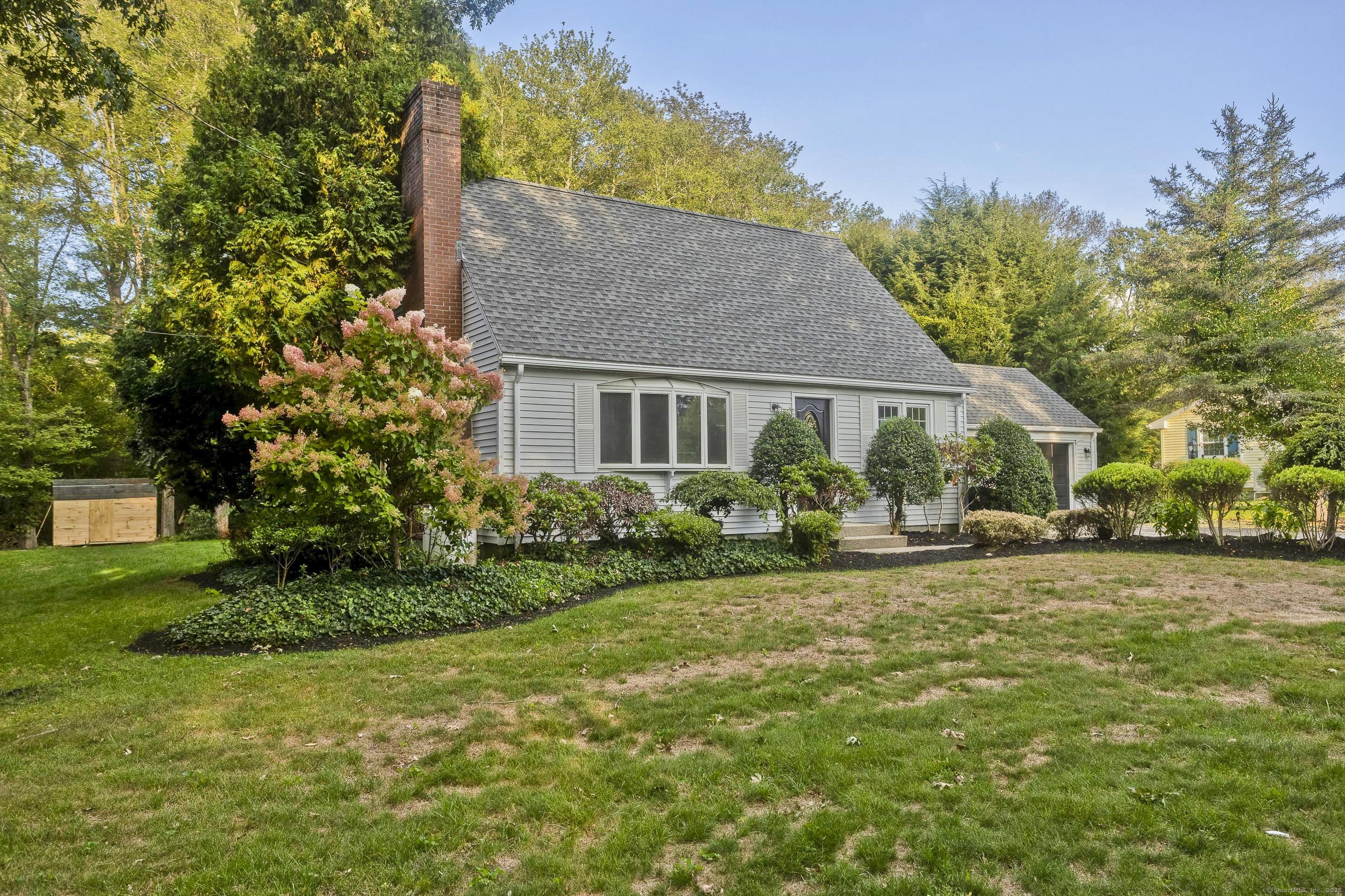 a house view with a garden space