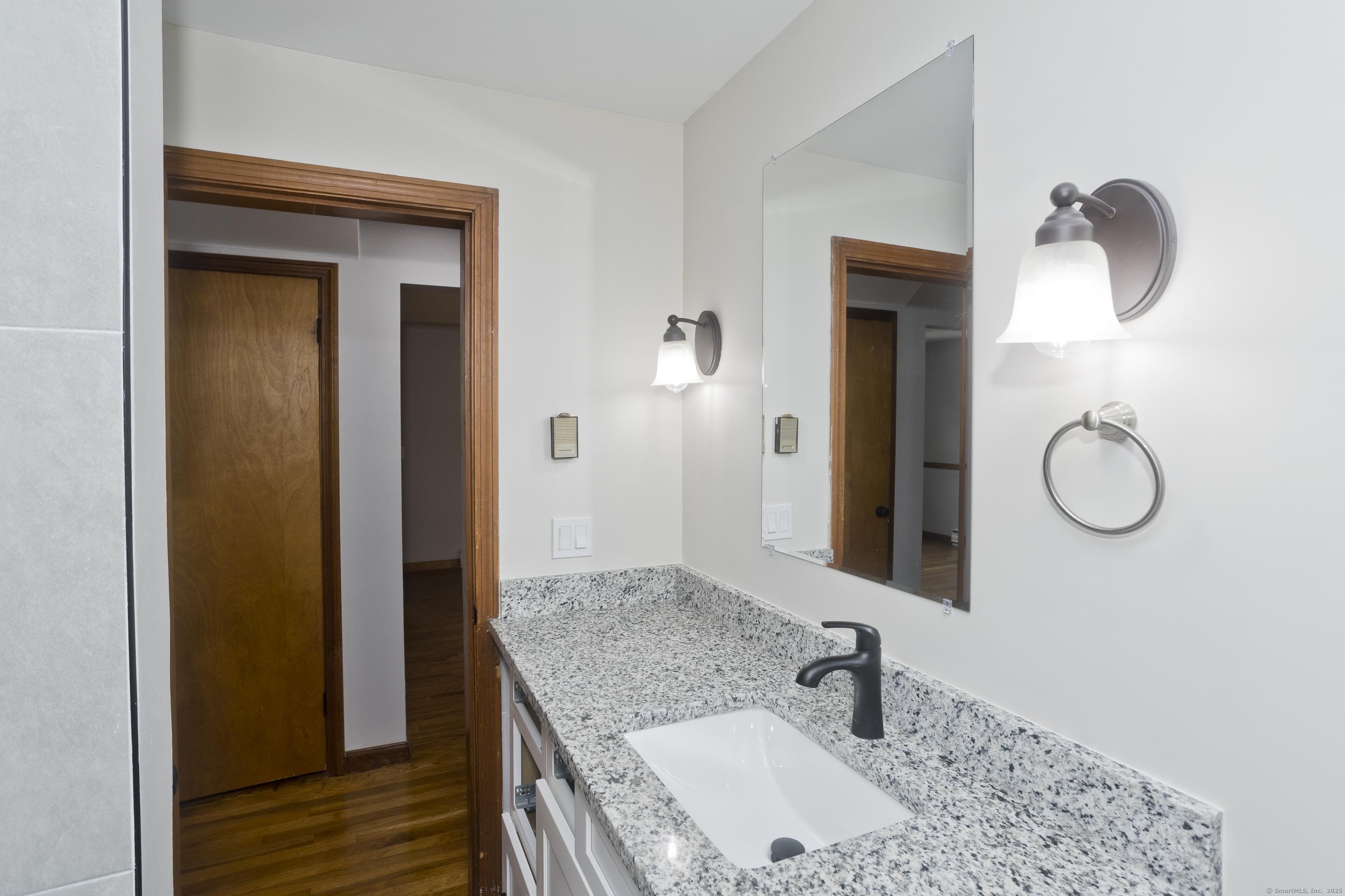 215 Sand Dam Road Thompson, CT 06277 - Photo 20 of 36 a bathroom with a sink and a mirror