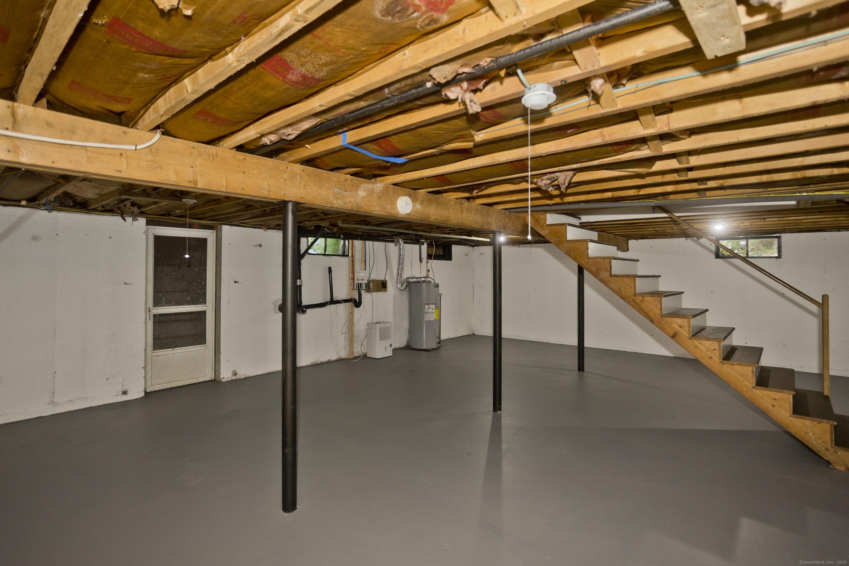 215 Sand Dam Road Thompson, CT 06277 - Photo 25 of 36 a view of an empty room with stairs