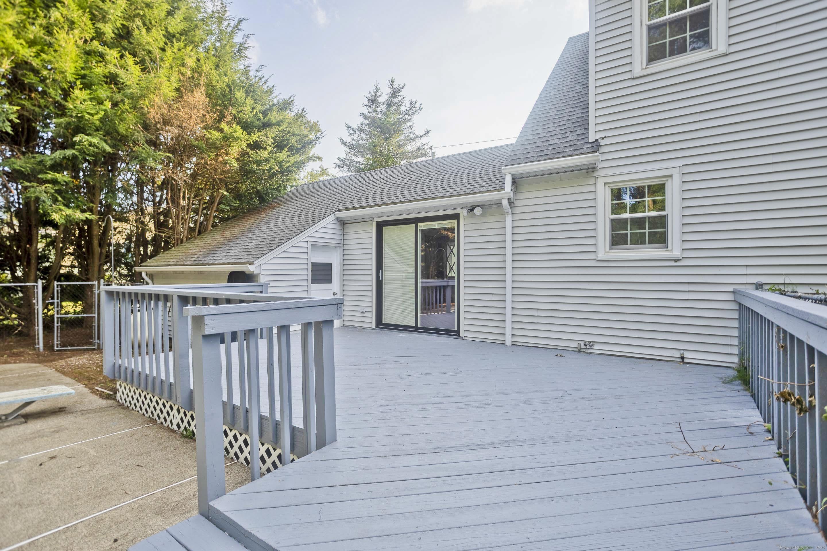 215 Sand Dam Road Thompson, CT 06277 - Photo 29 of 36 a view of a house with a deck