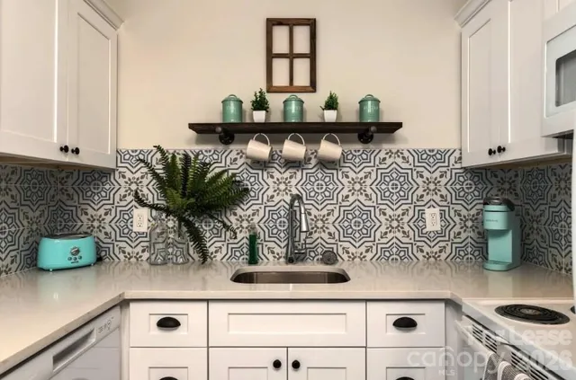 a kitchen with a stove and cabinets