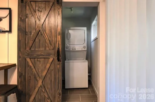a room with a door and wooden floor