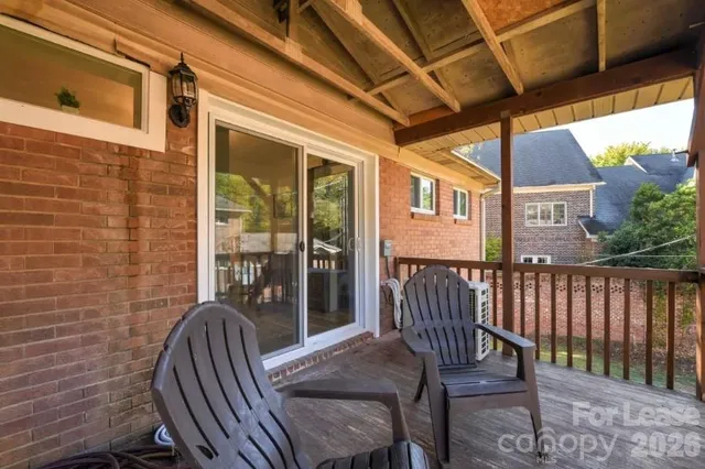 a view of a patio with a table and chairs