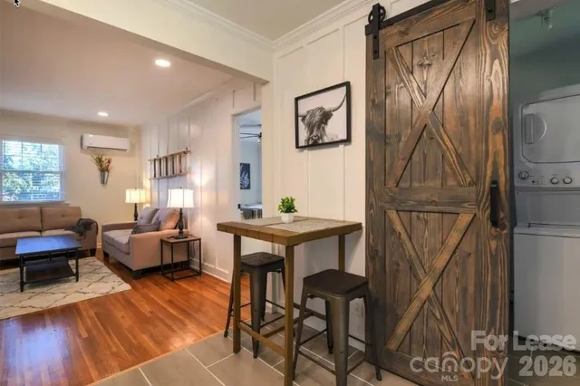 a living room with furniture a window and a table