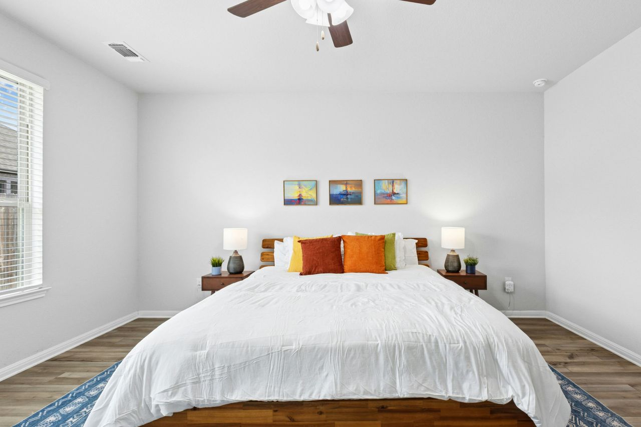 242 Backstays Loop Kyle, TX 78640 - Photo 19 of 36 a bedroom with a bed and window