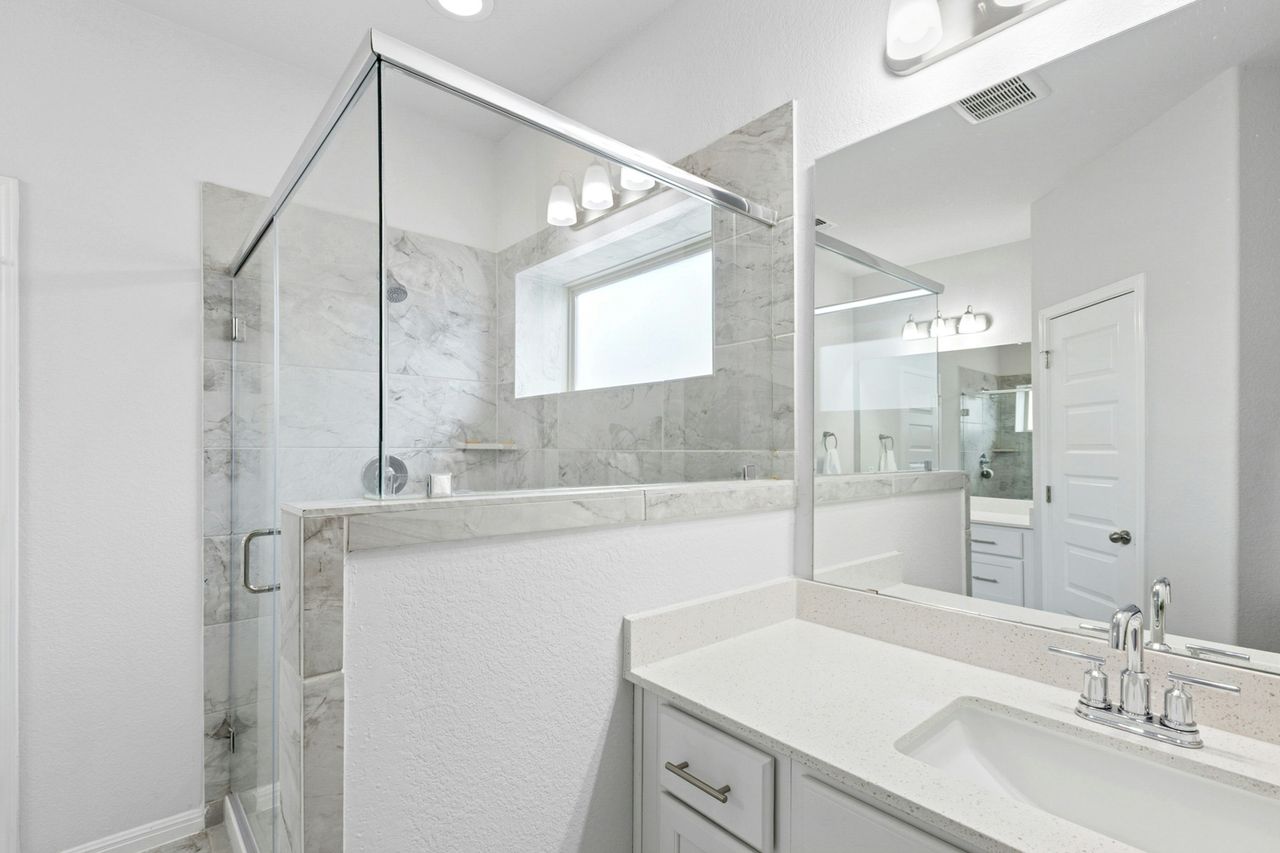 242 Backstays Loop Kyle, TX 78640 - Photo 21 of 36 a bathroom with a sink and a mirror