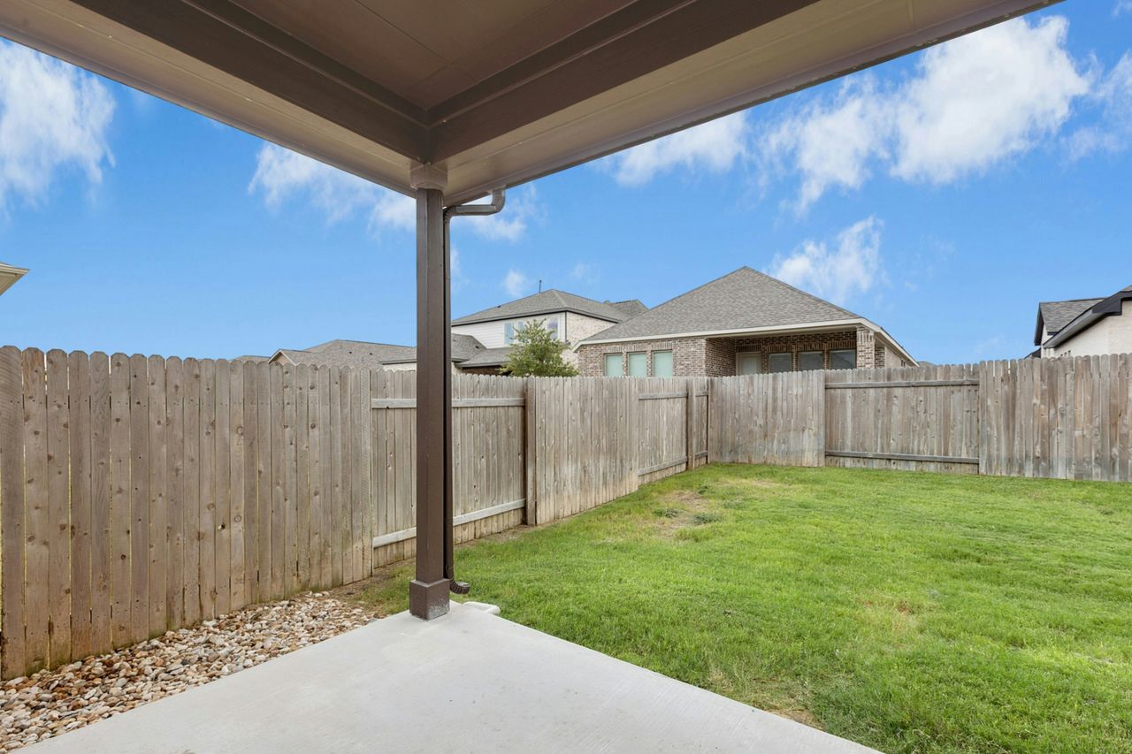 242 Backstays Loop Kyle, TX 78640 - Photo 33 of 36 a view of a backyard with wooden fence