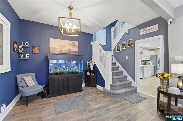 a living room with furniture and stairs