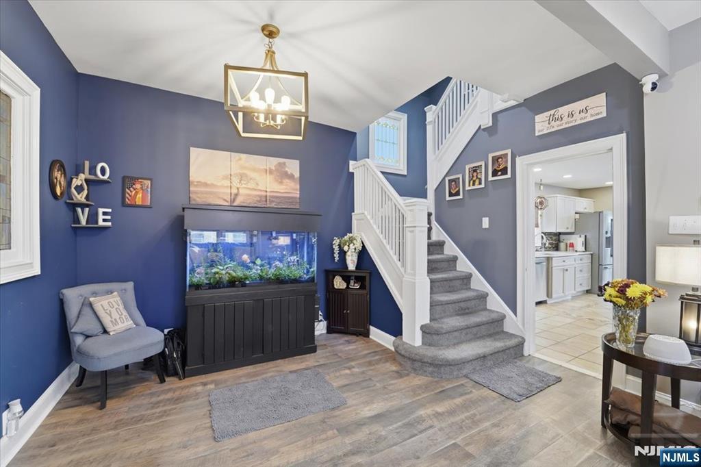 486 Devon Street Kearny, NJ 07032 - Photo 12 of 44 a living room with furniture and stairs