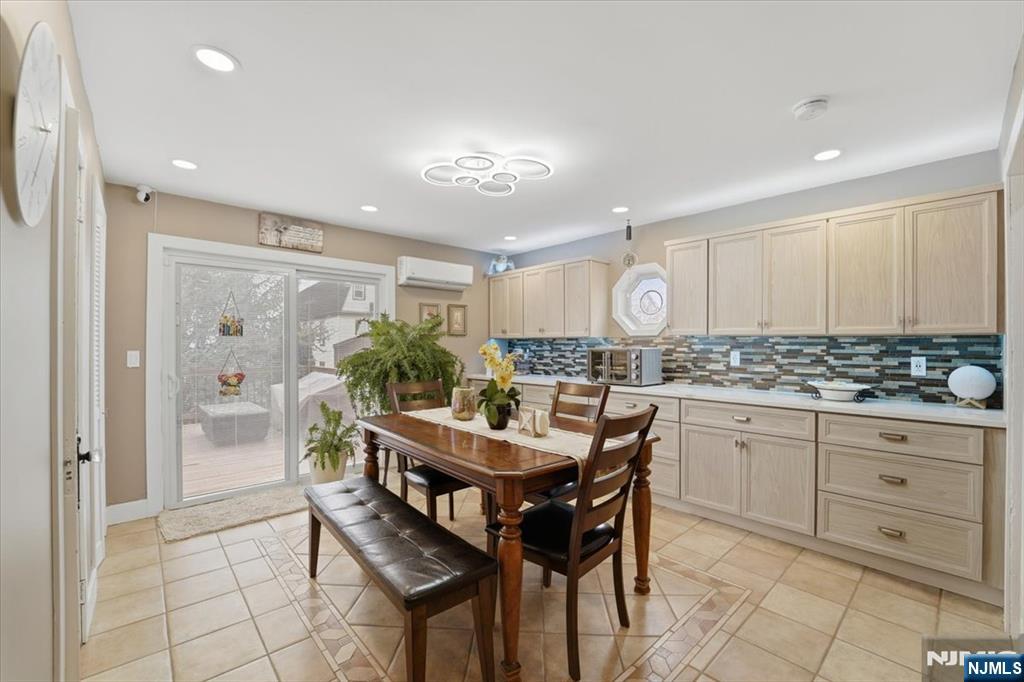486 Devon Street Kearny, NJ 07032 - Photo 16 of 44 a kitchen with granite countertop white cabinets and stainless steel appliances