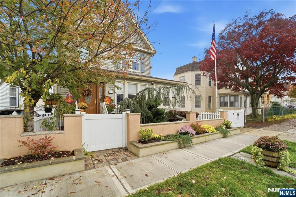 486 Devon Street Kearny, NJ 07032 - Photo 2 of 44 a view of a building with a yard and sitting area