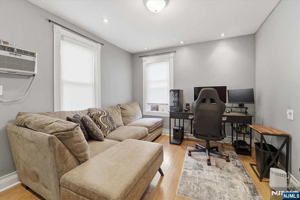 486 Devon Street Kearny, NJ 07032 - Photo 24 of 44 a living room with furniture and a window