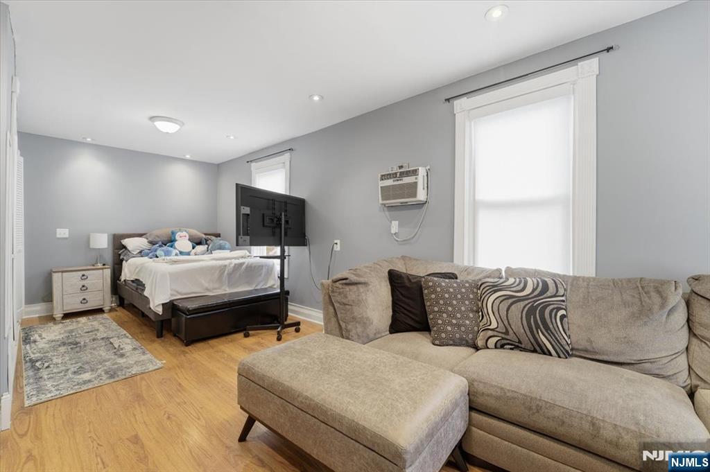 486 Devon Street Kearny, NJ 07032 - Photo 25 of 44 a bedroom with furniture and a couch