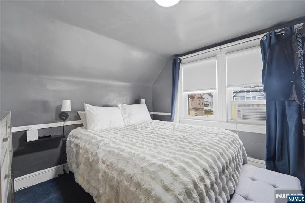 486 Devon Street Kearny, NJ 07032 - Photo 29 of 44 a bedroom with a bed and a window