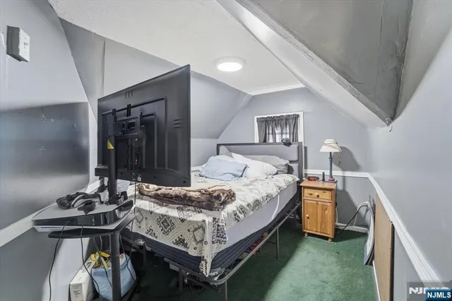 a bedroom with a bed and a table