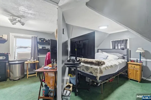 a bed room with furniture and a window