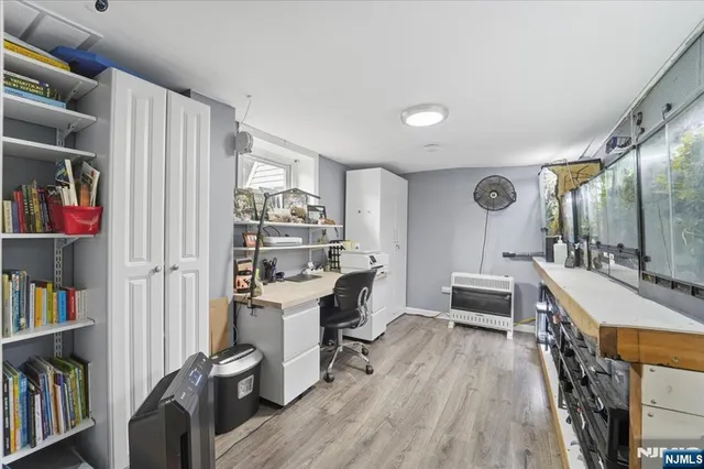 a view of a workspace with furniture and bathroom