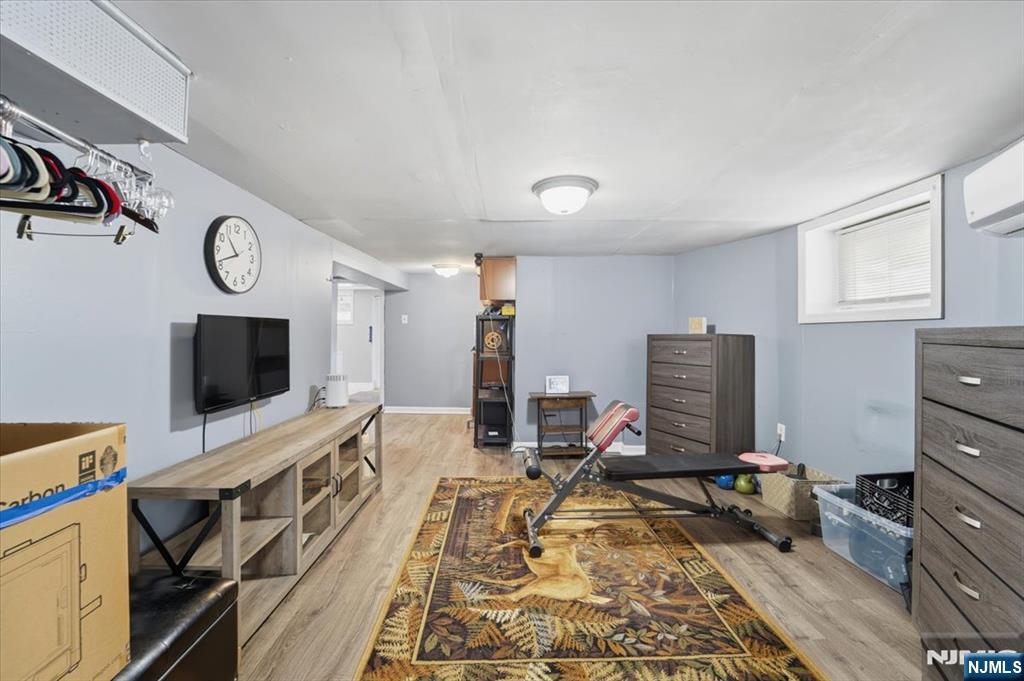 486 Devon Street Kearny, NJ 07032 - Photo 37 of 44 a view of a livingroom with furniture and a flat screen tv