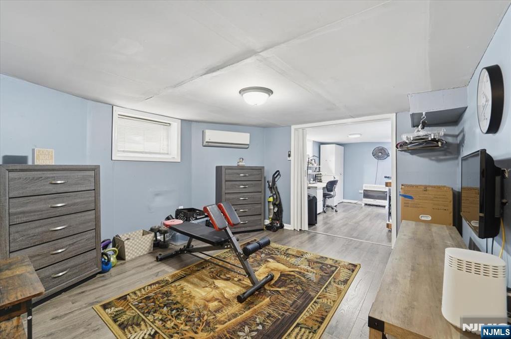 486 Devon Street Kearny, NJ 07032 - Photo 39 of 44 a view of a workspace with furniture and a window