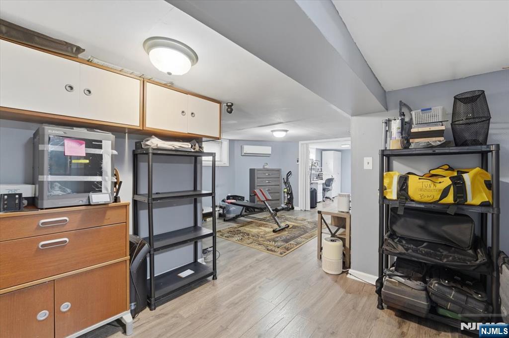 486 Devon Street Kearny, NJ 07032 - Photo 40 of 44 a living room with furniture a flat screen tv and kitchen view