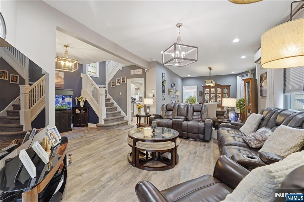 486 Devon Street Kearny, NJ 07032 - Photo 10 of 44 a living room with furniture and a chandelier