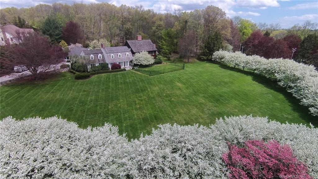 405 North Cedar Road Fairfield, CT 06824 - Photo 1 of 1 a backyard of a house with lots of green space