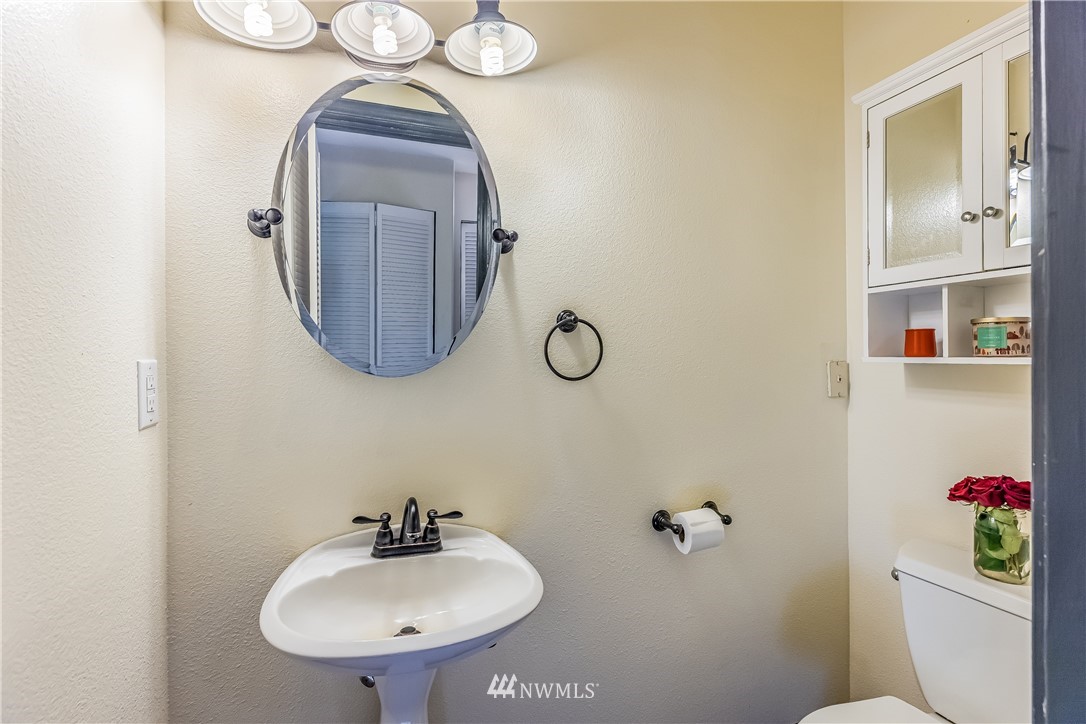 36901 Mann Road Sultan, WA 98294 - Photo 22 of 40 a bathroom with a sink mirror and toilet