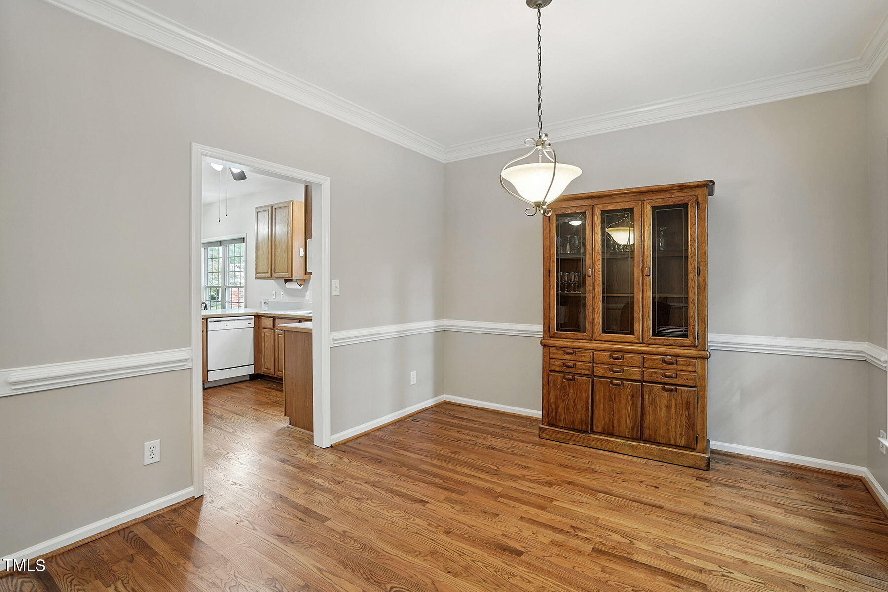 2425 Lemuel Drive Raleigh, NC 27615 - Photo 10 of 36 a view of a kitchen with wooden floor and a window