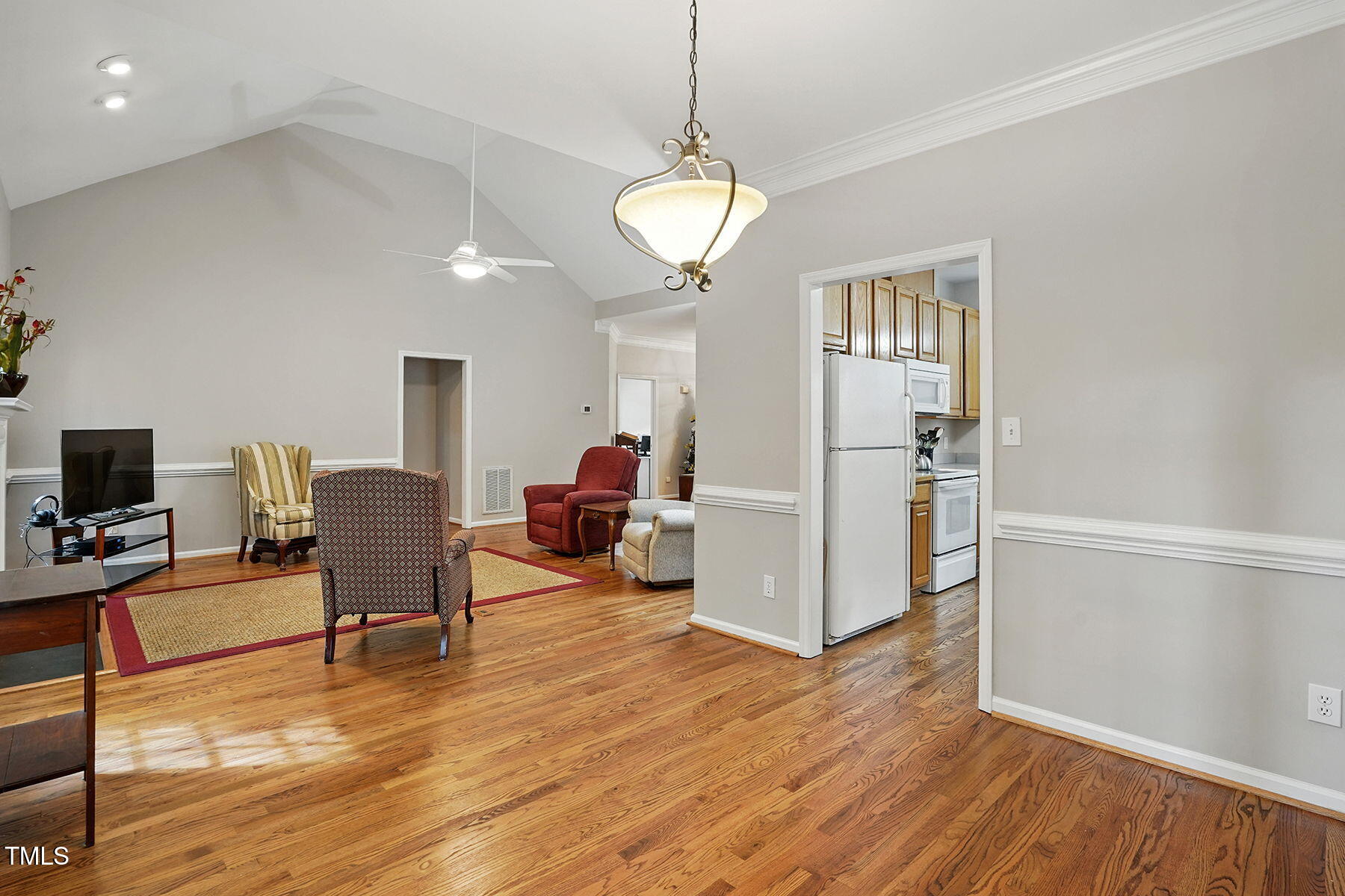 2425 Lemuel Drive Raleigh, NC 27615 - Photo 11 of 36 a view of a livingroom with furniture a ceiling fan and wooden floor