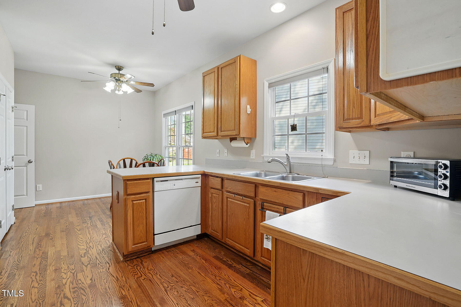 2425 Lemuel Drive Raleigh, NC 27615 - Photo 12 of 36 a kitchen with stainless steel appliances granite countertop a sink a stove and a wooden floors