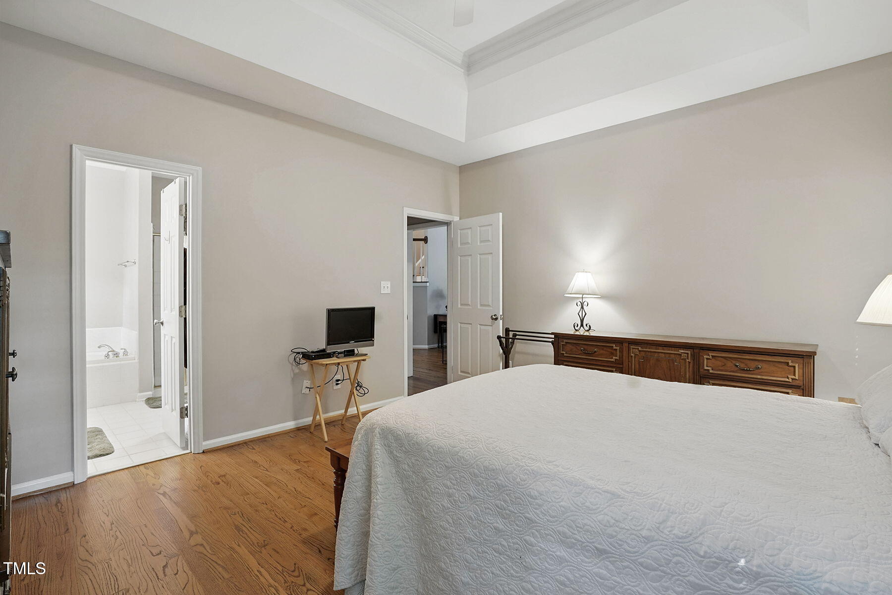 2425 Lemuel Drive Raleigh, NC 27615 - Photo 18 of 36 a bedroom with a bed and wooden floor