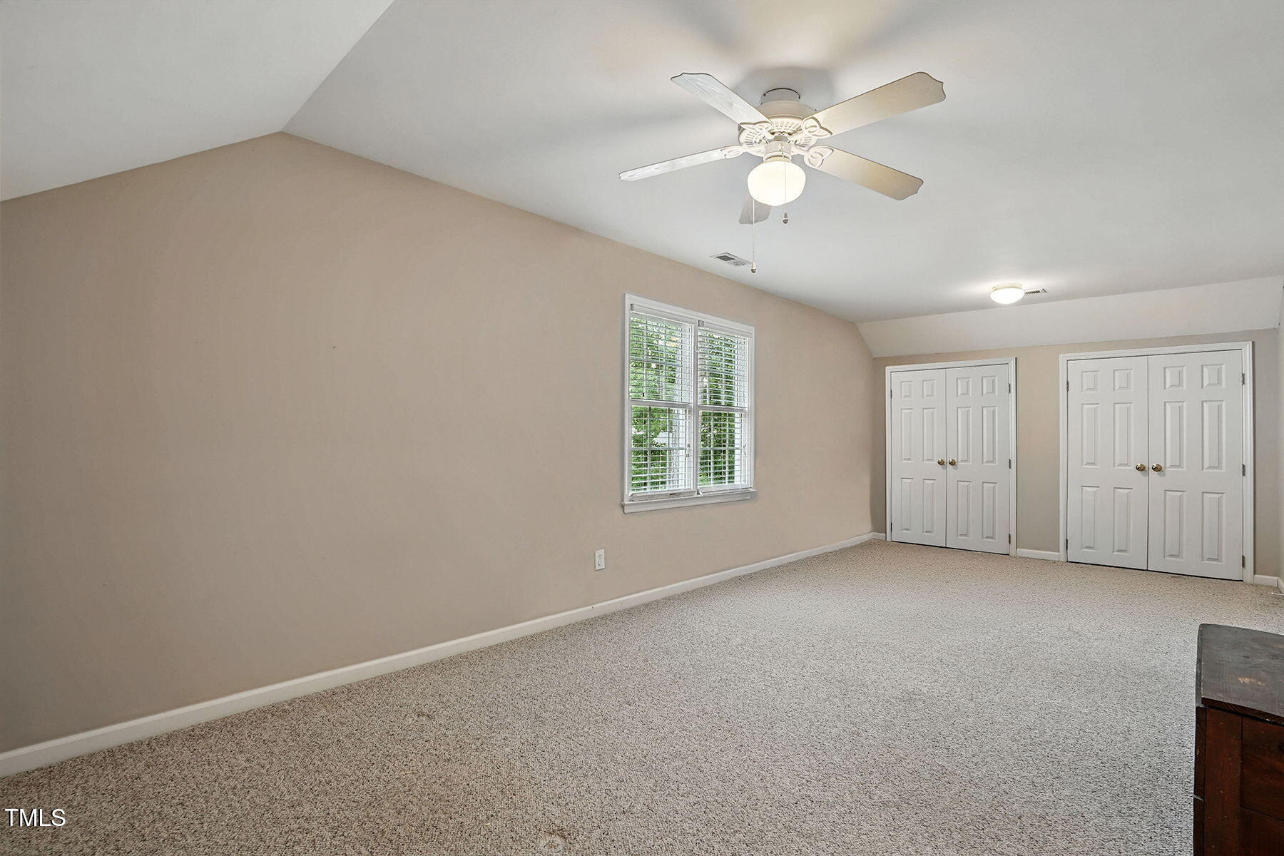 2425 Lemuel Drive Raleigh, NC 27615 - Photo 26 of 36 an empty room with windows and fan