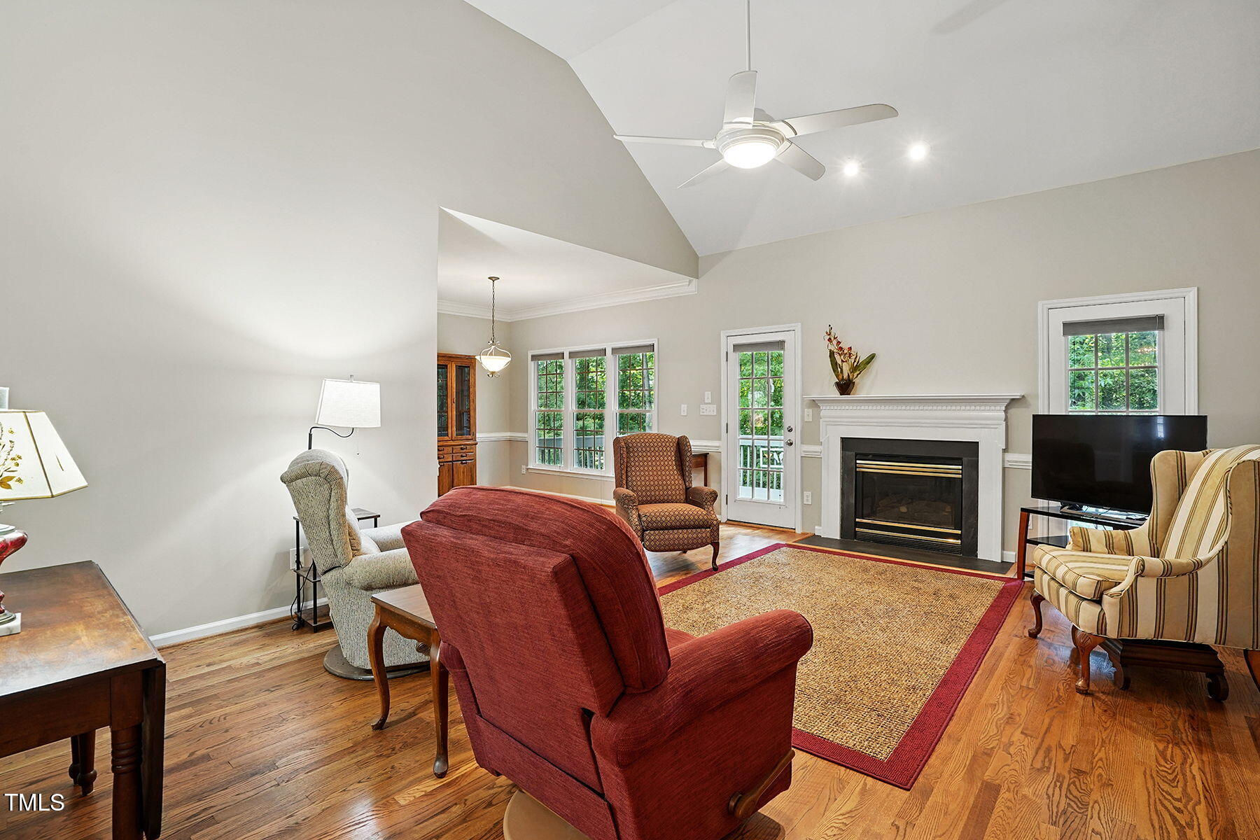 2425 Lemuel Drive Raleigh, NC 27615 - Photo 8 of 36 a living room with furniture and a fireplace