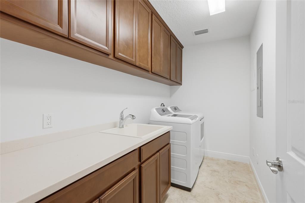 10520 Boardwalk Loop, Unit 301 Bradenton, FL 34202 - Photo 29 of 55 a utility room with sink dryer and washer