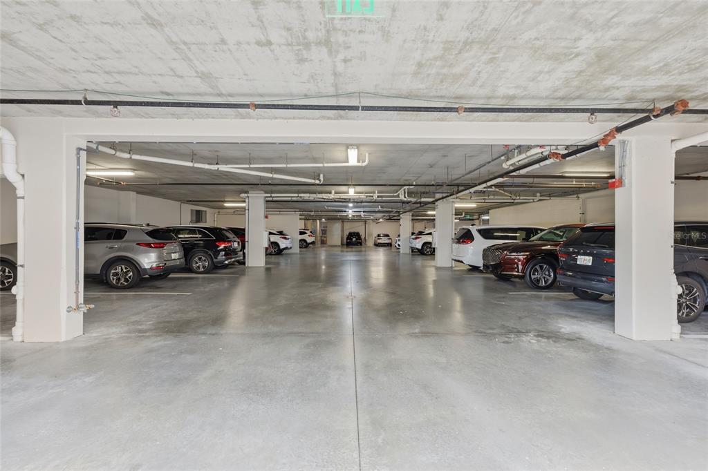 10520 Boardwalk Loop, Unit 301 Bradenton, FL 34202 - Photo 31 of 55 a view of parking garage with cars