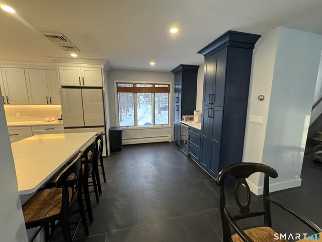a view of a kitchen with furniture and a window