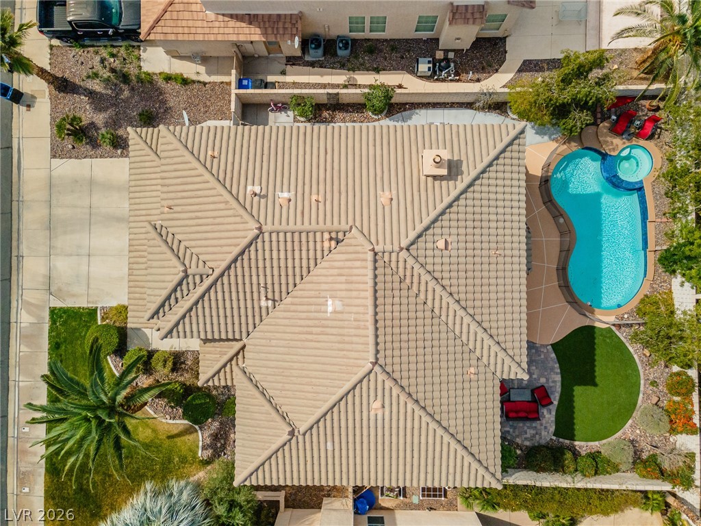 2504 Putting Green Drive Henderson, NV 89074 - Photo 48 of 56 An aerial view showcases the home's roof, yard, and pool, creating an inviting outdoor retreat.