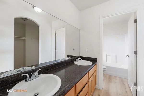 a bathroom with a toilet and a bathtub