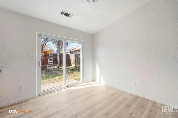 a kitchen with a wooden floor and a sink